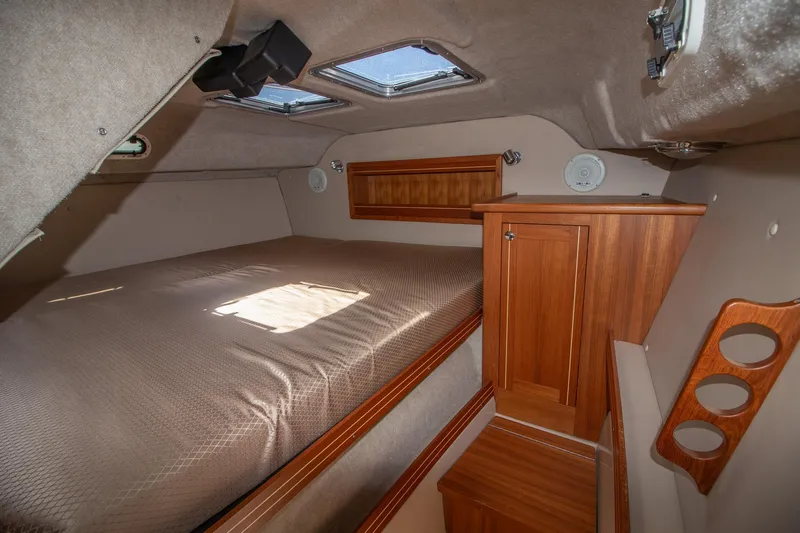 R Time Yacht Photos Pics Cozy cabin interior of 2013 Aspen C90 with wood accents and skylights.