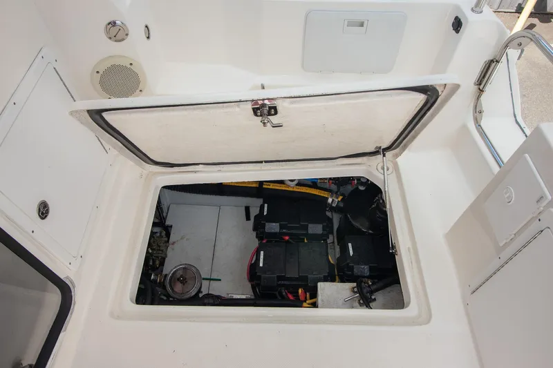 R Time Yacht Photos Pics Engine compartment of 2013 Aspen C90 boat, showcasing internal components and storage.