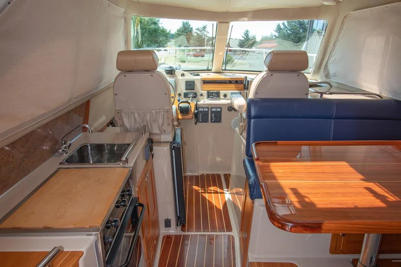 R Time Yacht Photos Pics Interior of 2013 Aspen C90 boat with kitchen, seating, and navigation area.