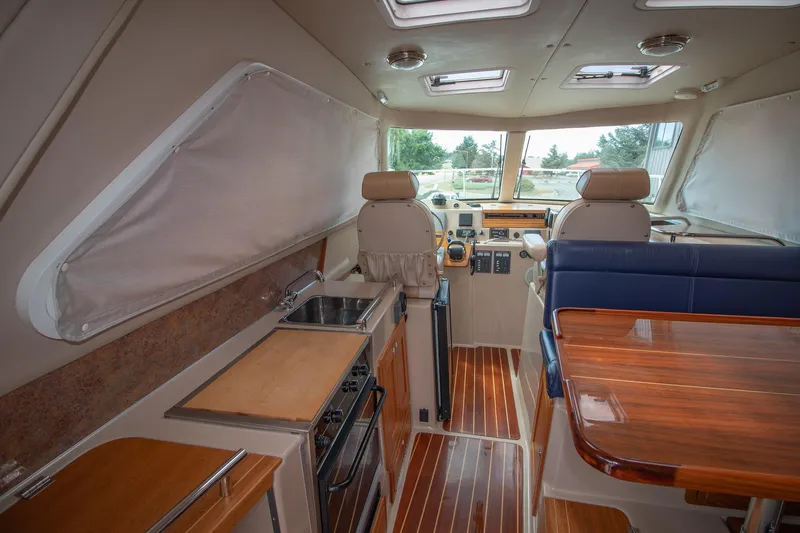 R Time Yacht Photos Pics Interior of 2013 Aspen C90 yacht with kitchen, seating, and navigation area.