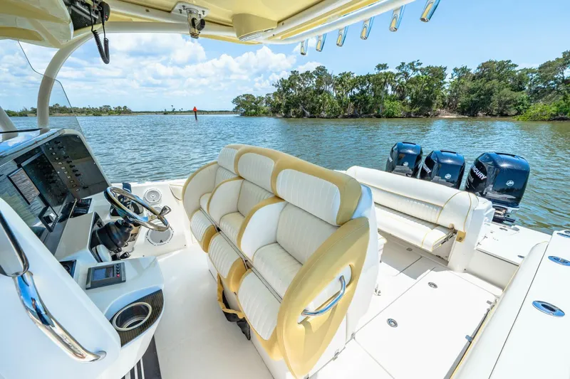  Yacht Photos Pics 2013 Nor-Tech 340 SS boat interior with plush seating and advanced controls on a scenic waterway.