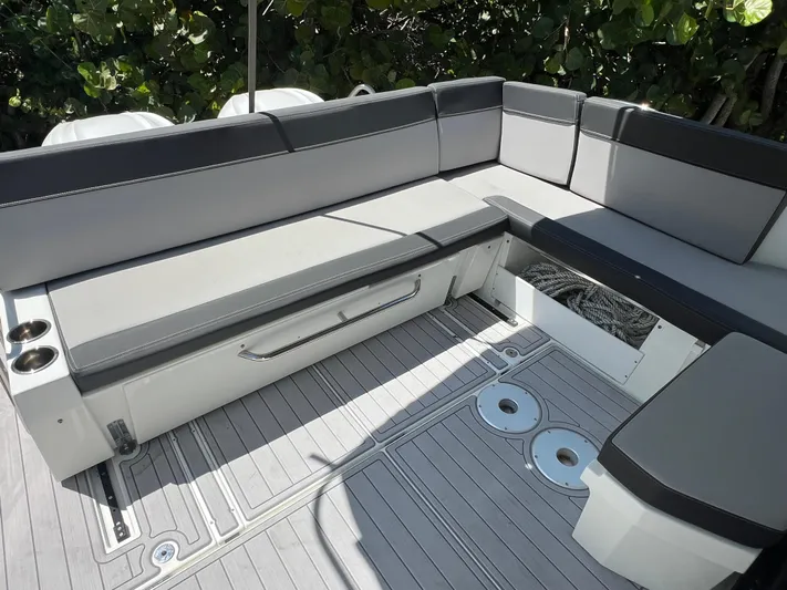  Yacht Photos Pics 2023 Jeanneau 1095 NC boat interior with sleek seating and storage compartments.