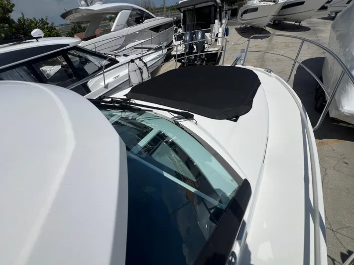  Yacht Photos Pics 2023 Jeanneau 1095 NC boat docked, showcasing sleek design and modern features.