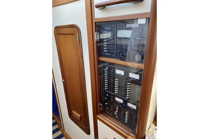 Escapade Yacht Photos Pics Electrical panel inside 1999 Legacy Yachts 40 Sedan, featuring control switches and gauges.