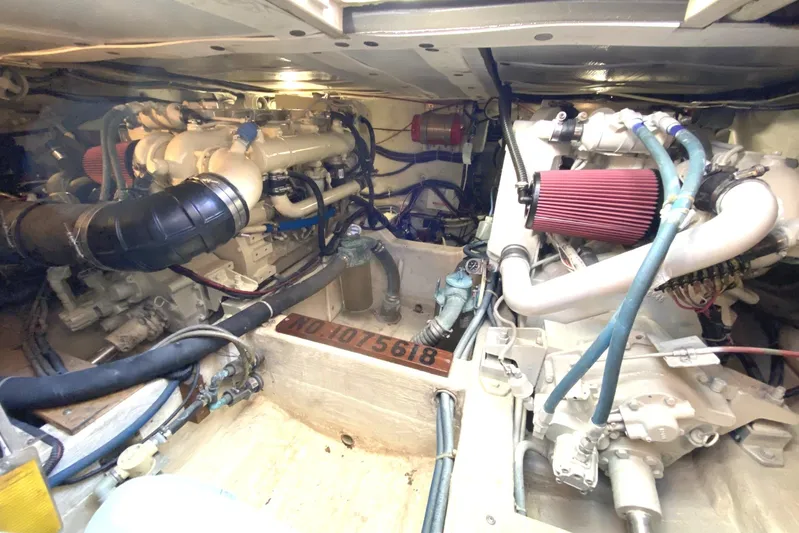 Escapade Yacht Photos Pics Engine room of 1999 Legacy Yachts 40 Sedan, showcasing dual engines and mechanical components.