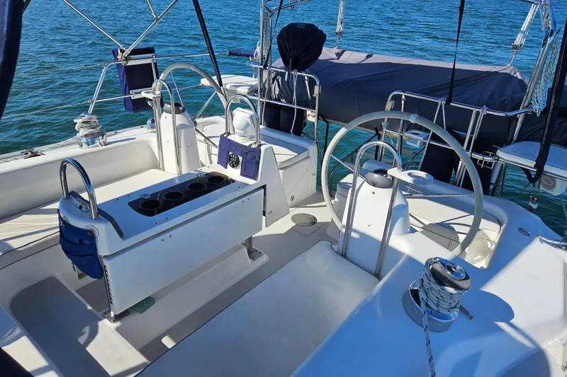"juniper" Yacht Photos Pics 2006 Catalina 400 MkII sailboat cockpit with dual steering wheels and ocean backdrop.