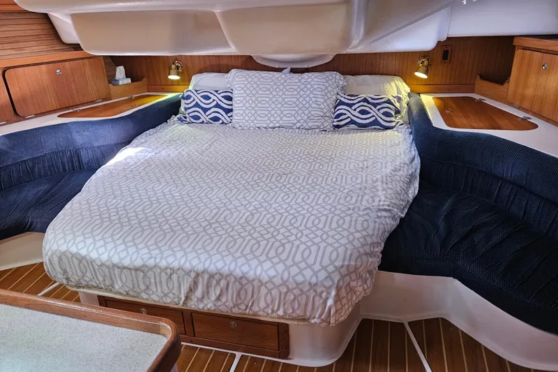 "juniper" Yacht Photos Pics Cozy cabin interior of 2006 Catalina 400 MkII sailboat with comfortable bedding.