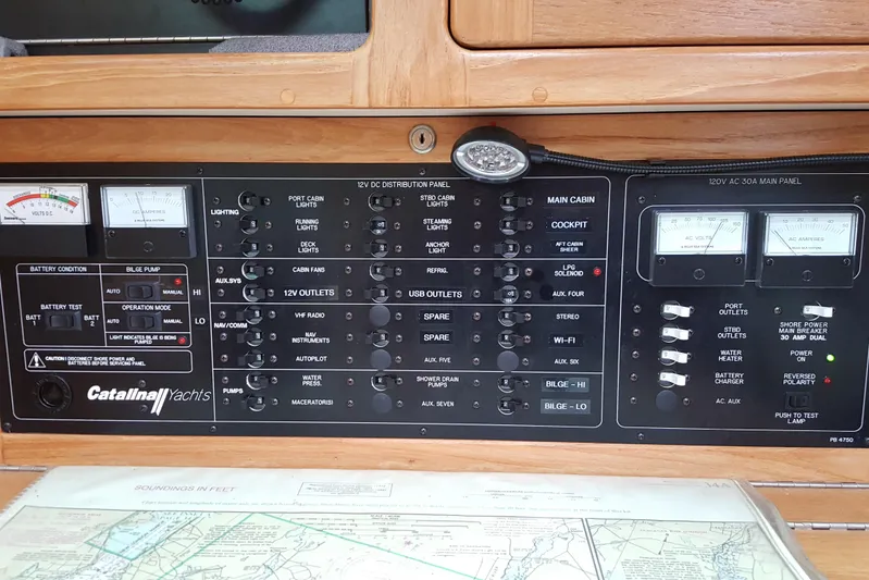 "juniper" Yacht Photos Pics Electrical control panel of a 2006 Catalina 400 MkII yacht with various switches and gauges.
