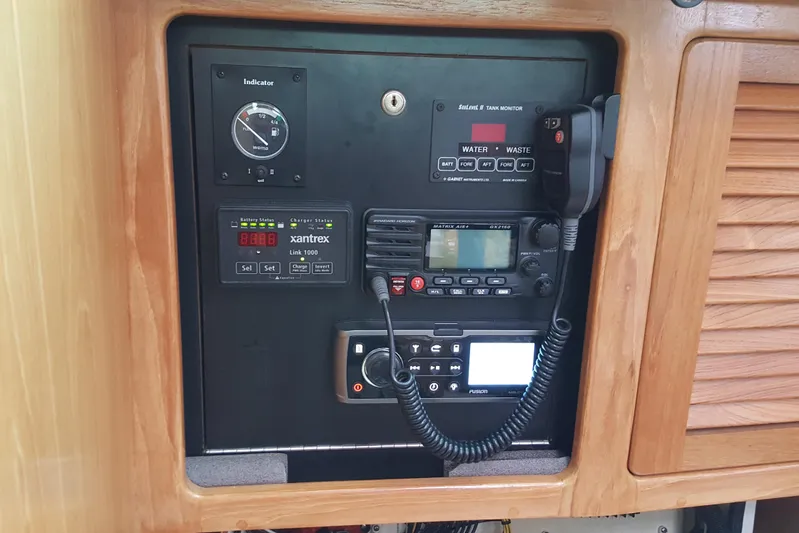 "juniper" Yacht Photos Pics Control panel of a 2006 Catalina 400 MkII sailboat with communication and monitoring equipment.