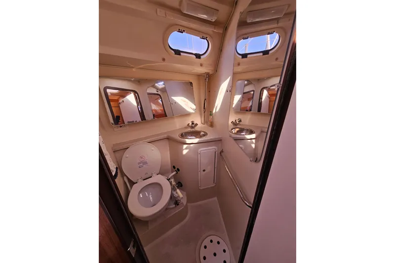 "juniper" Yacht Photos Pics Interior of 2006 Catalina 400 MkII yacht bathroom with toilet and sink.