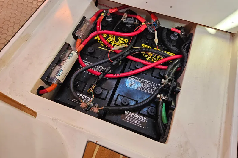 "juniper" Yacht Photos Pics Deep cycle batteries in a 2006 Catalina 400 MkII sailboat, with red and black cables.