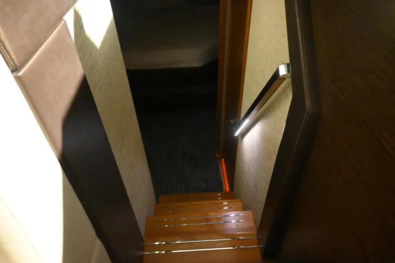 Present Tense Yacht Photos Pics Night time view of the 2017 Tiara 44 Coupe featuring handrail courtesy lighting. Night Time View