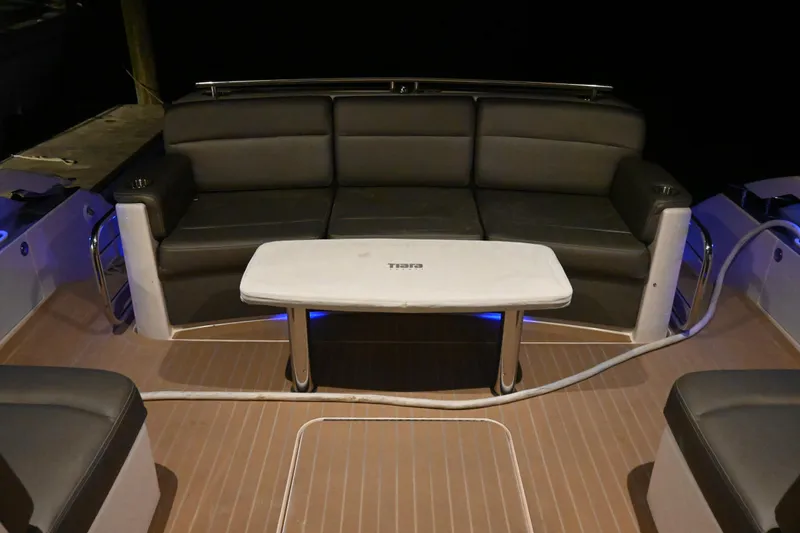 Present Tense Yacht Photos Pics 2017 Tiara 44 Coupe yacht interior with sleek seating and table.
