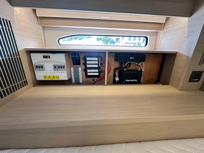  Yacht Photos Pics 2025 Jeanneau DB/37 OB electrical panel and Raymarine system in cabin interior.