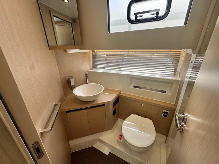  Yacht Photos Pics 2025 Jeanneau DB/37 OB yacht bathroom with modern fixtures and natural lighting.