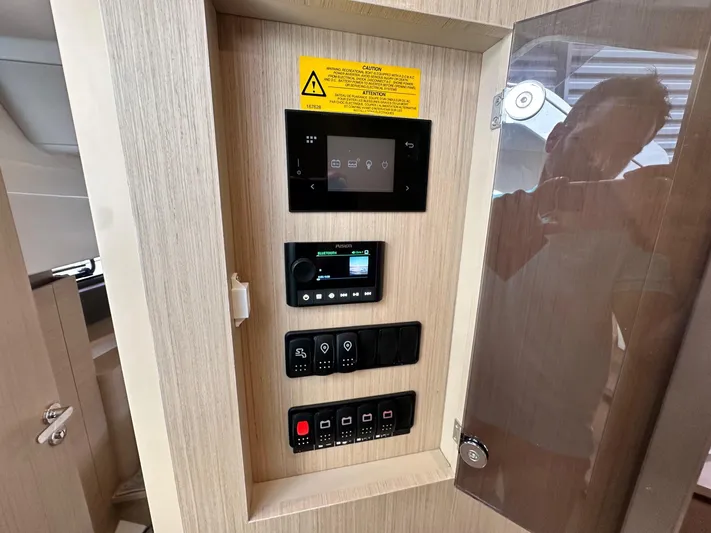  Yacht Photos Pics Control panel inside 2025 Jeanneau DB/37 OB boat, featuring digital displays and switches.