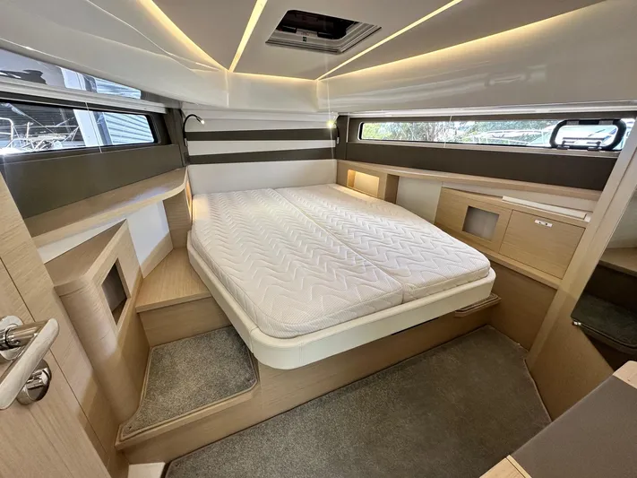  Yacht Photos Pics 2025 Jeanneau DB/37 OB cabin interior with modern design and comfortable bedding.