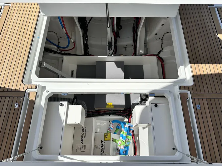  Yacht Photos Pics 2025 Jeanneau DB/37 OB boat storage compartment with visible wiring and equipment.