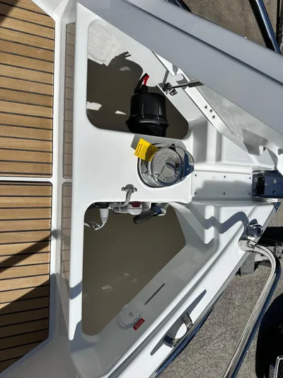  Yacht Photos Pics 2025 Jeanneau DB/37 OB boat deck with fuel cap and wooden flooring.