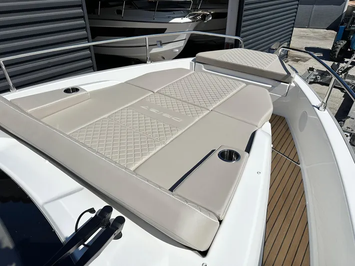 Yacht Photos Pics 2025 Jeanneau DB/37 OB boat with beige cushioned deck and stainless steel railings.