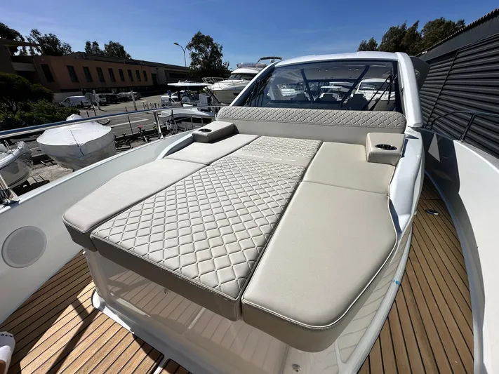  Yacht Photos Pics 2025 Jeanneau DB/37 OB boat with luxurious sunbed and sleek design.