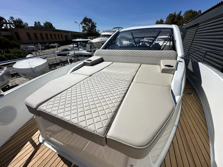  Yacht Photos Pics 2025 Jeanneau DB/37 OB boat with luxurious sunbed and sleek design.