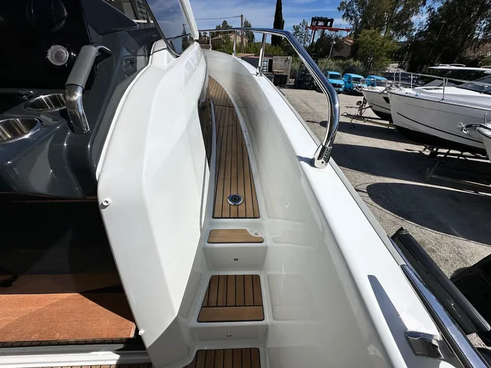  Yacht Photos Pics 2025 Jeanneau DB/37 OB boat deck with sleek design and wooden accents.