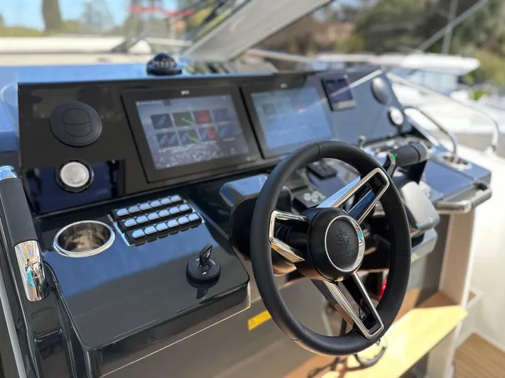  Yacht Photos Pics 2025 Jeanneau DB/37 OB helm with modern controls and touchscreen displays.