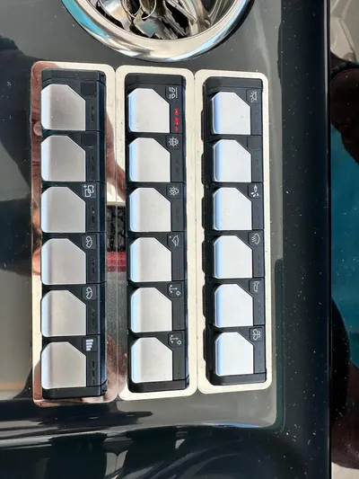  Yacht Photos Pics Control panel of 2025 Jeanneau DB/37 OB boat with various switches.