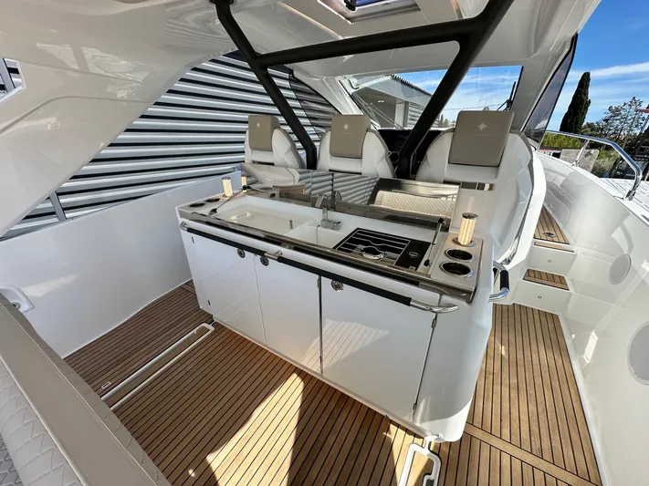  Yacht Photos Pics Luxurious 2025 Jeanneau DB/37 OB yacht interior with sleek kitchen and seating area.