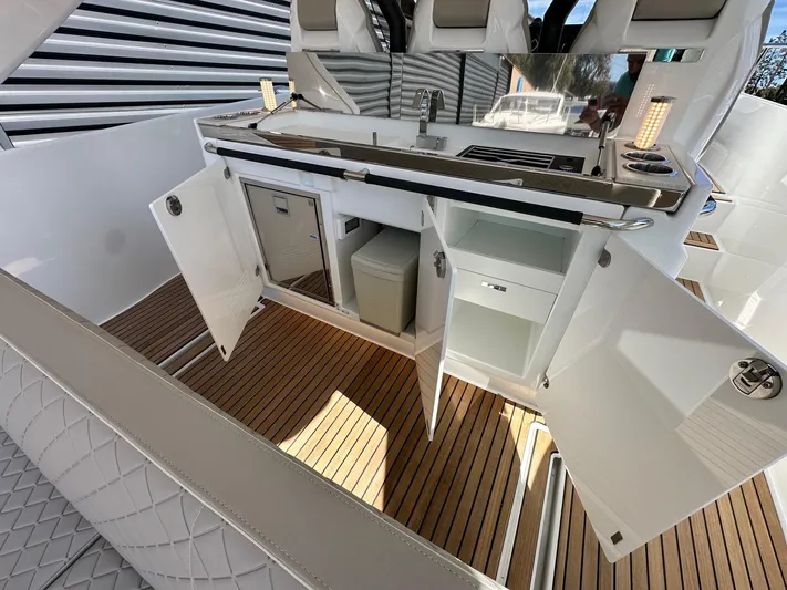 Yacht Photos Pics 2025 Jeanneau DB/37 OB yacht interior with open cabinets and modern amenities.
