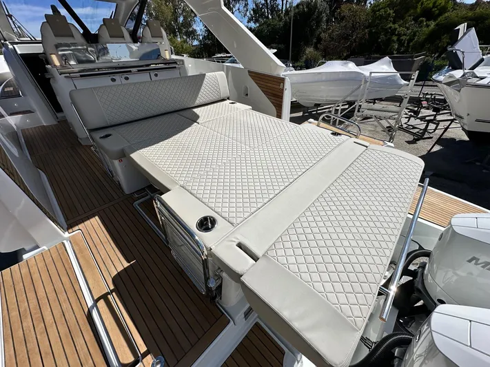  Yacht Photos Pics 2025 Jeanneau DB/37 OB boat with luxurious seating and teak flooring.