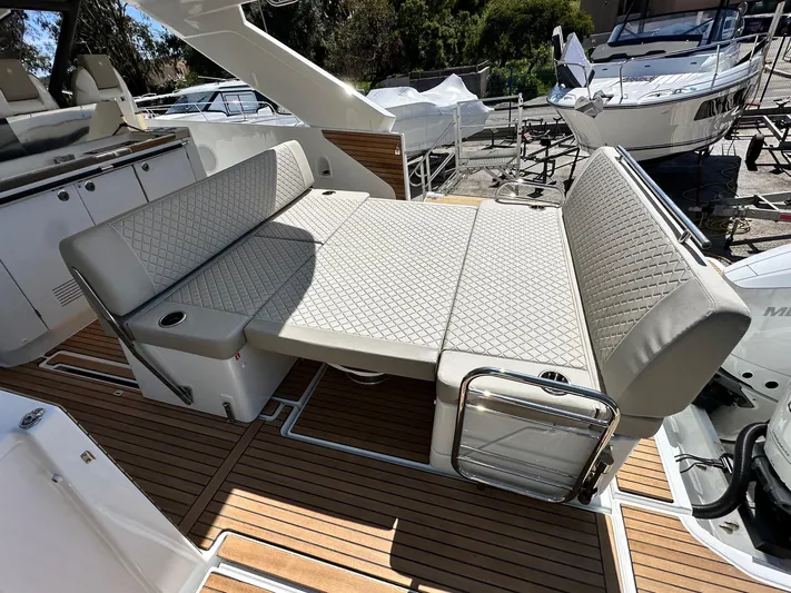  Yacht Photos Pics 2025 Jeanneau DB/37 OB boat with convertible seating and teak flooring.