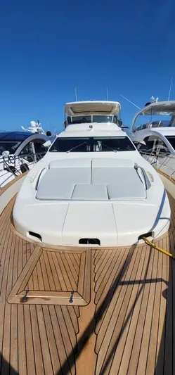 Thinks It's His Too Yacht Photos Pics 2008 Azimut Flybridge yacht with spacious deck and sunbathing area.