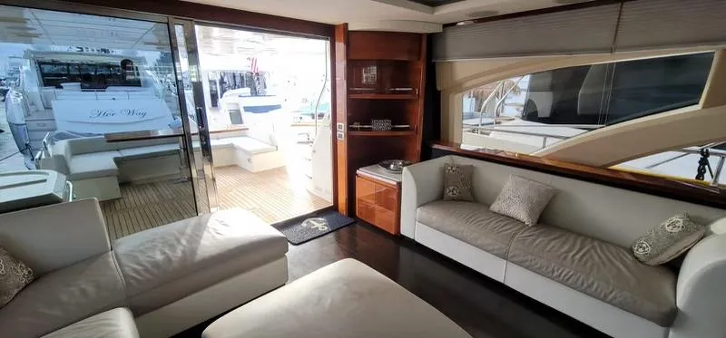 Thinks It's His Too Yacht Photos Pics Luxurious interior of a 2008 Azimut Flybridge yacht with modern seating and outdoor view.
