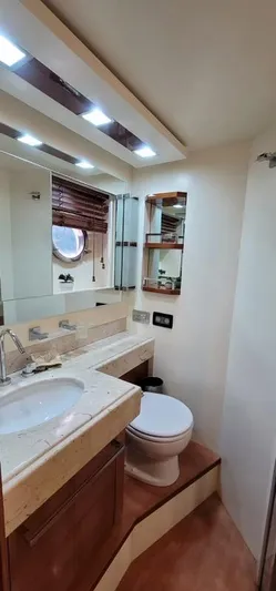 Thinks It's His Too Yacht Photos Pics Luxurious bathroom in a 2008 Azimut Flybridge yacht with modern fixtures and ample lighting.