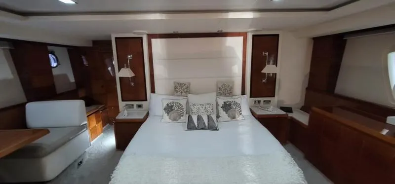 Thinks It's His Too Yacht Photos Pics Luxurious bedroom in a 2008 Azimut Flybridge yacht with modern decor.
