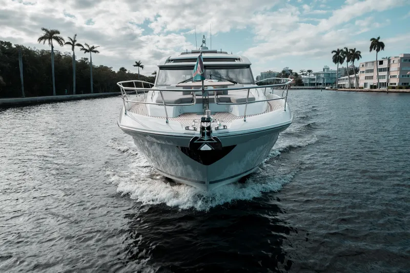  Yacht Photos Pics 2019 Prestige 590 S yacht cruising on a scenic waterway.