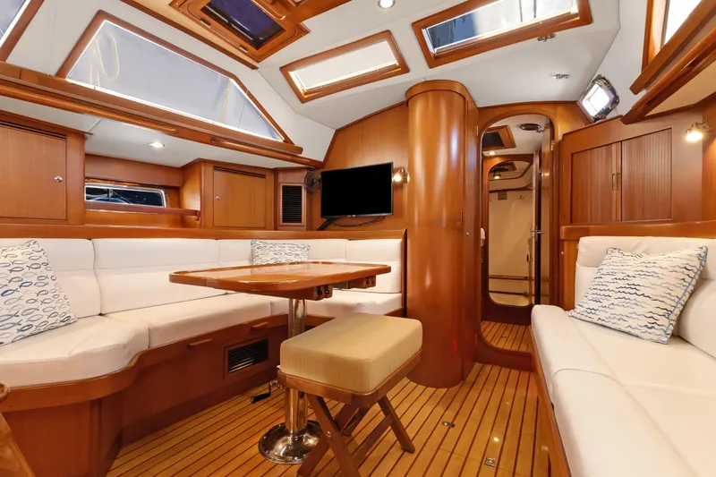 Avventura Yacht Photos Pics Luxurious interior of 2009 Hylas 46 yacht with wood finish and plush seating.