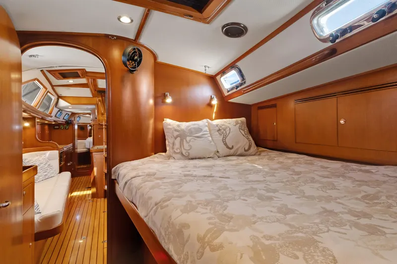 Avventura Yacht Photos Pics Luxurious 2009 Hylas 46 yacht interior with cozy bedroom and elegant wood finish.