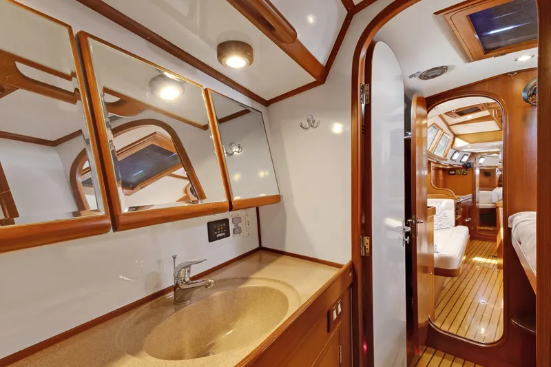 Avventura Yacht Photos Pics Luxurious 2009 Hylas 46 yacht interior with elegant wood finish and modern amenities.