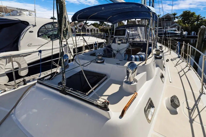 Avventura Yacht Photos Pics 2009 Hylas 46 yacht docked, featuring sleek design and spacious deck layout.