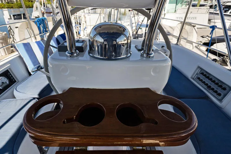 Avventura Yacht Photos Pics Cockpit of 2009 Hylas 46 yacht with wooden cup holders and blue seating.