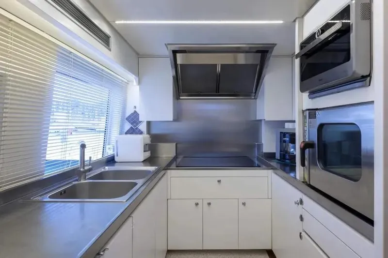  Yacht Photos Pics Modern kitchen interior on Codecasa Falco 24 yacht, featuring sleek appliances and minimalist design, 2017.