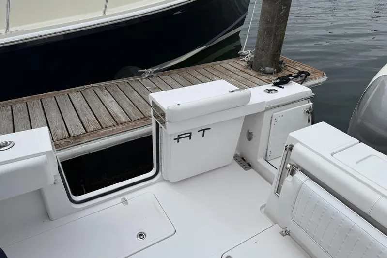  Yacht Photos Pics 2018 Southport 33 FE boat interior with white seating and wooden dock.