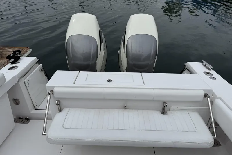  Yacht Photos Pics 2018 Southport 33 FE boat with dual outboard engines and white seating.