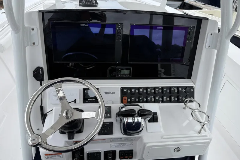  Yacht Photos Pics 2018 Southport 33 FE boat dashboard with steering wheel and dual Simrad displays.