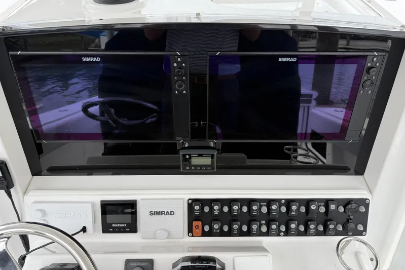  Yacht Photos Pics Control panel of 2018 Southport 33 FE boat with Simrad displays and switches.