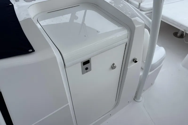  Yacht Photos Pics 2018 Southport 33 FE boat interior with white storage compartment and seating area.