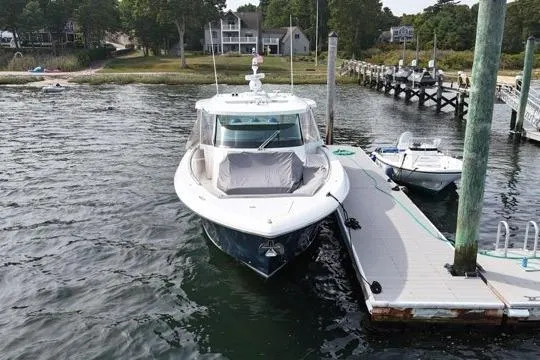 Carry On Yacht Photos Pics 2021 Tiara Sport 43 LS luxury boat docked at marina with scenic background.